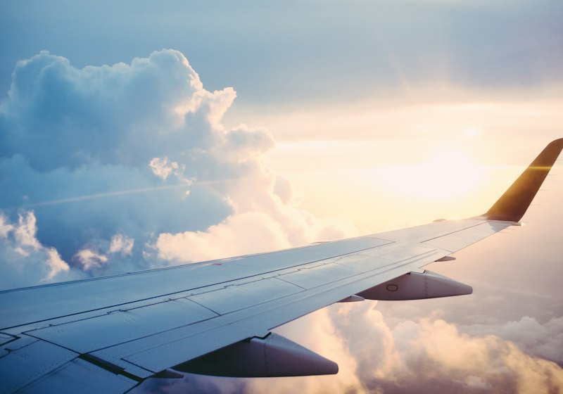 Airplane wing above the clouds