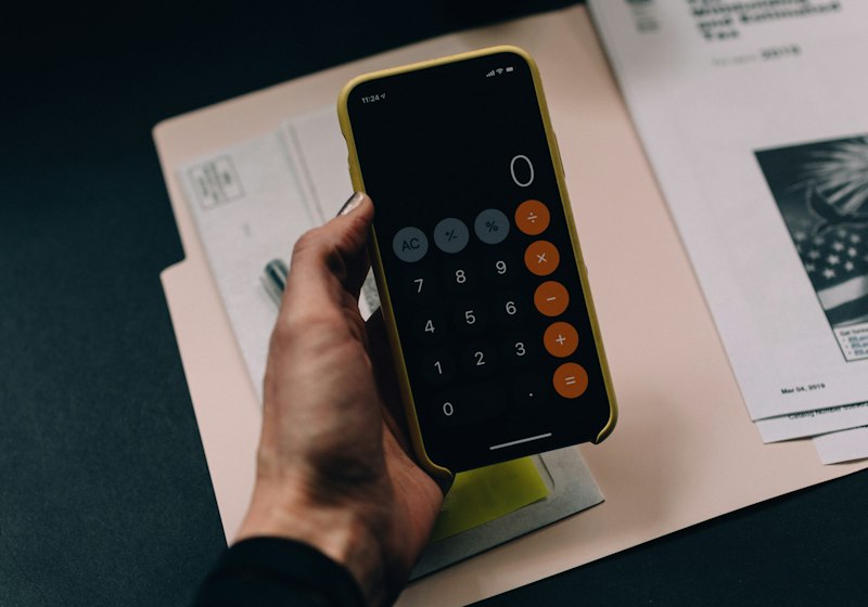 Calculator and tax paperwork on a desk